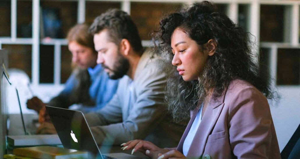 Diversity Australia - Diversity and Inclusion Consultants Brisbane three people of diverse backgrounds looking at laptop screens