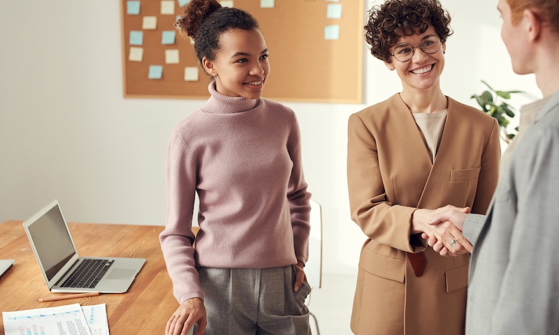 Diversity Australia - Diversity and Inclusion Consultants Brisbane corporate women shaking hands in an office