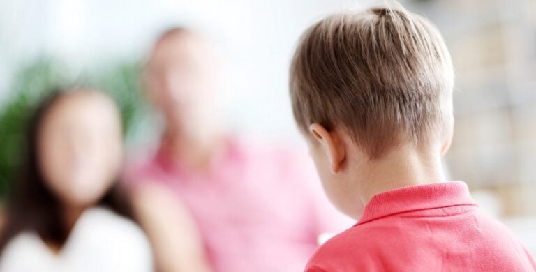 Child at home facing parents